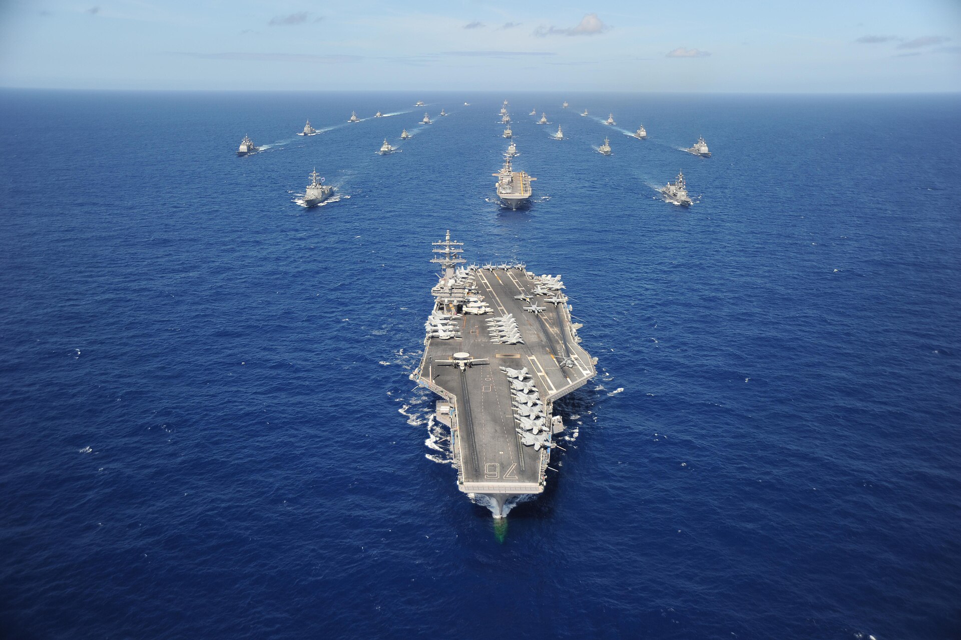 The Nimitz-class nuclear aircraft carrier USS Ronald Reagan (CVN 76) leads a group of multinational ships during a photo exercise (PHOTOEX) during Rim of the Pacific (RIMPAC) 2010.